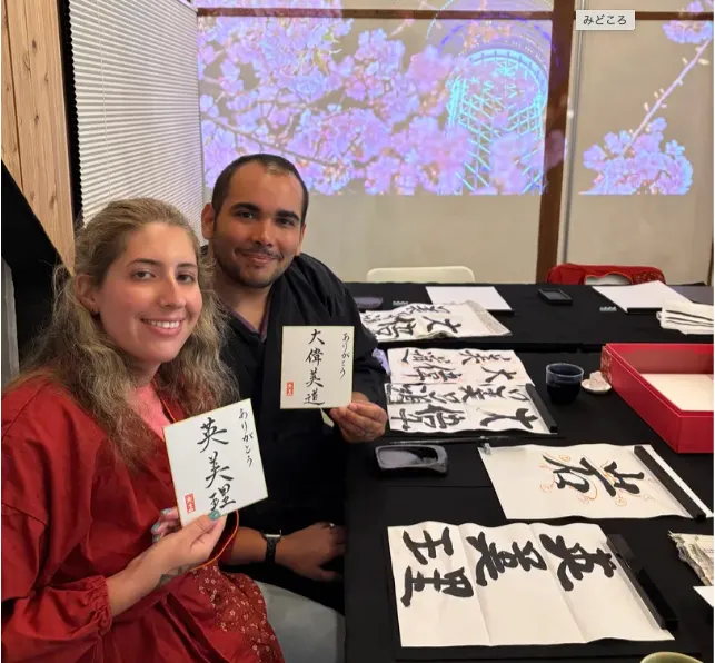 Guests holding their finished kanji cards